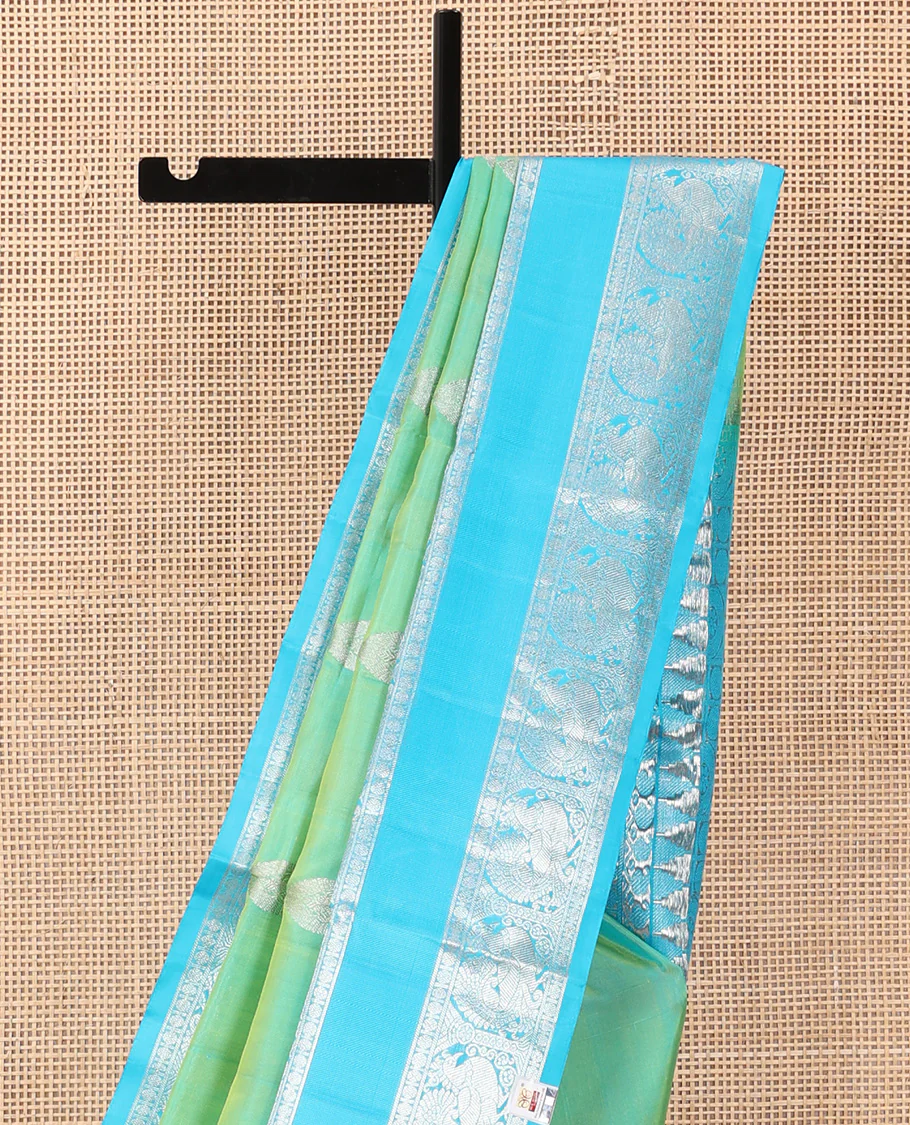 Aqua green dual-tone zari buttas Venkatagiri silk saree, contrast traditional zari rettai pettu border of peacock designs, and pallu of chakra, and rudraksham - Image 4