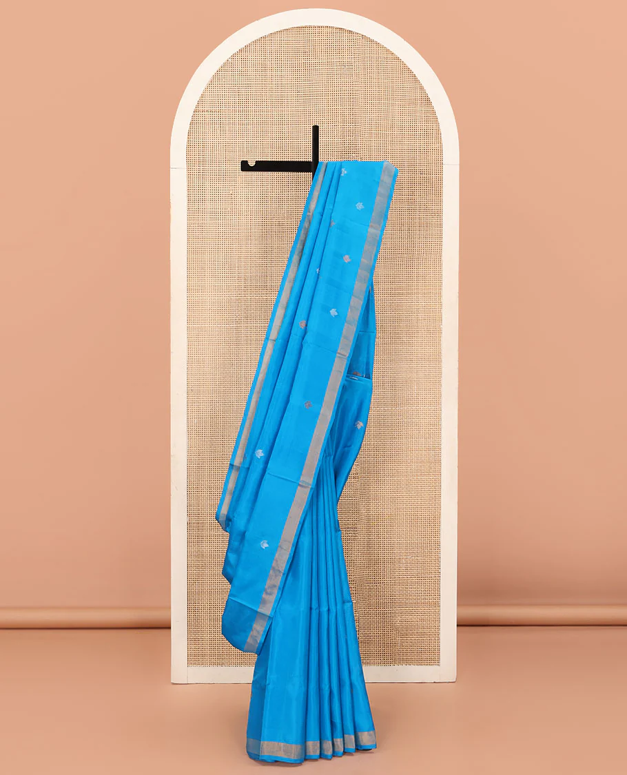 Azure Blue Uppada Silk Saree Featuring Floral Buttas, Subtle Zari Bavanji Border, Pallu Decked Up with Jamdani-Style Floral Motifs, and Paired with a Matching Blouse