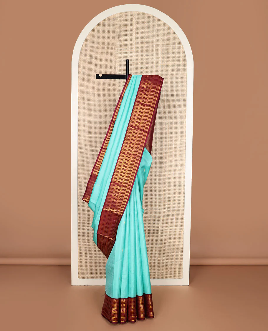 Baby blue zari buttas Vasundhara silk saree, contrast border of manga mokku,banaras,kamalam & rettai neli & jaal pallu