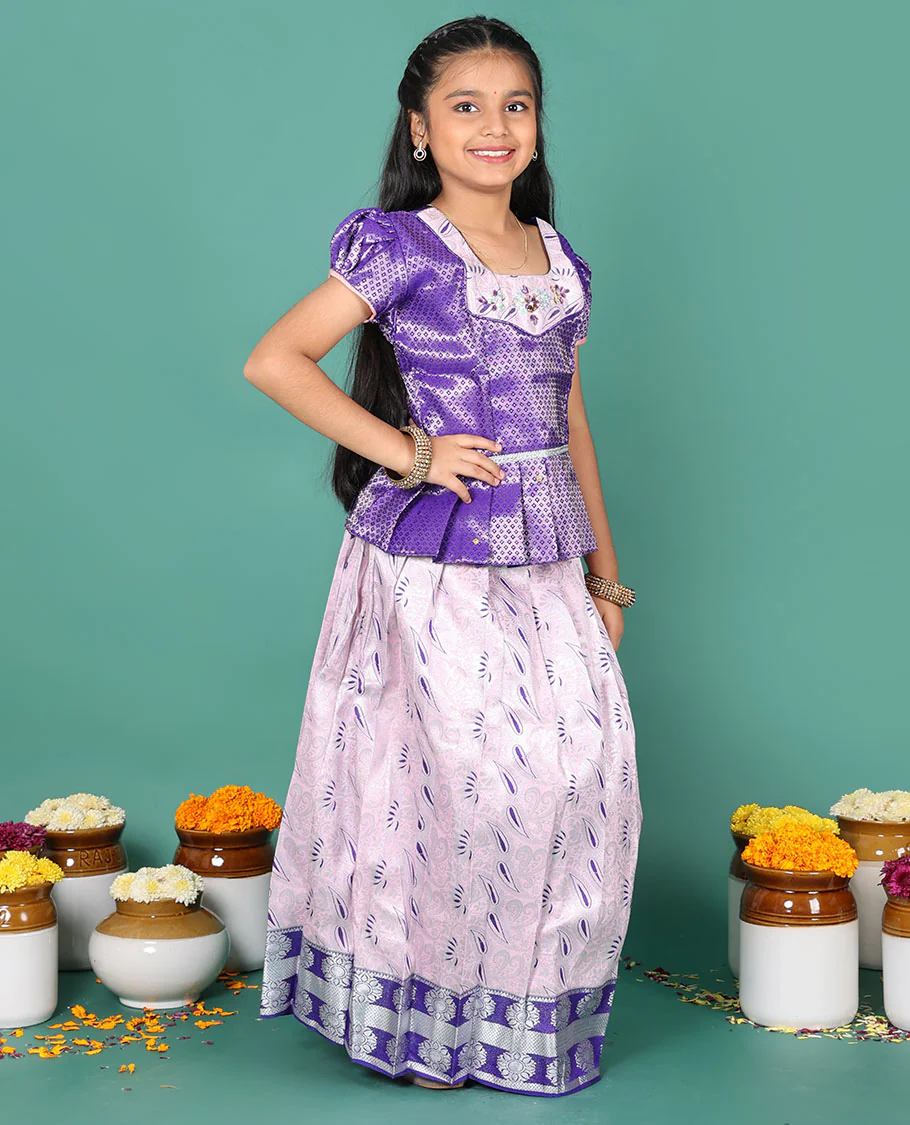 Baby pink readymade art silk pavadai, meenakari jacquard & contrast chakram zari border skirt, and contrast jacquard embroidered puff-sleeve blouse