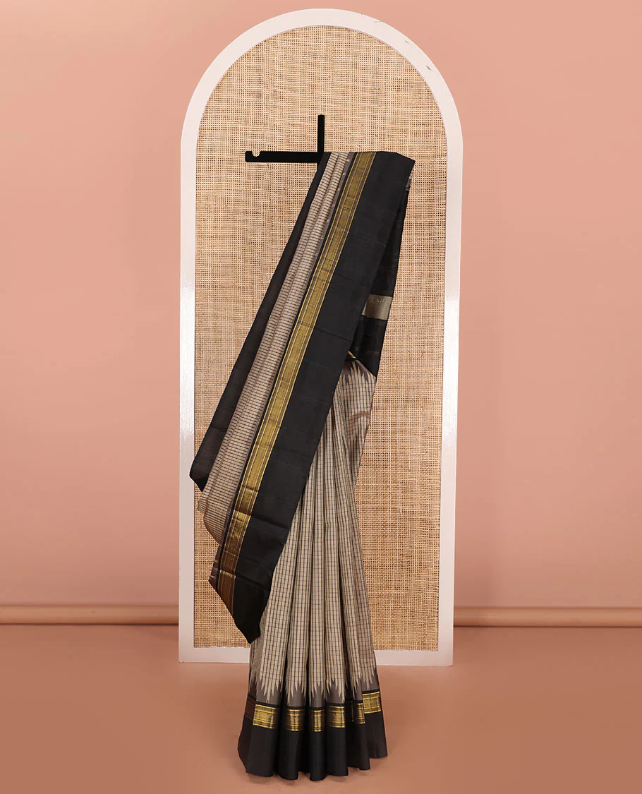 Beige checked Kanchipuram silk saree, contrast thazampoo rekku border of zari designs, and pallu of pillaiyar mokku designs