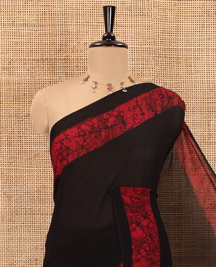 Black and rani pink plain georgette saree, batik printed border, batik printed checked pallu, and a matching blouse - Image 2
