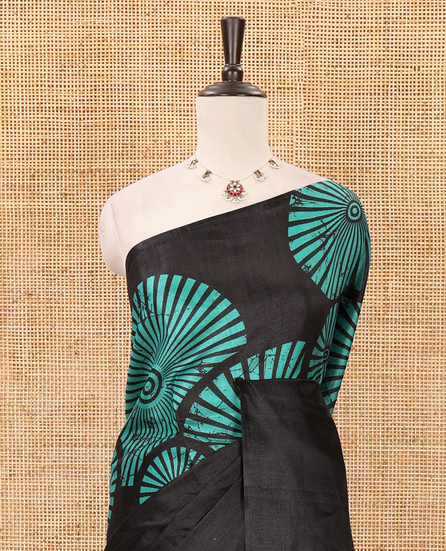 Black-base plain body khadi cotton saree with batik-style green-color radiant sunburst design on its border & pallu, plain black blouse - Image 3
