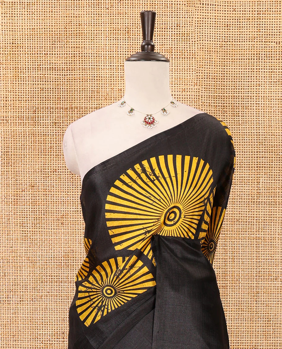 Black-base plain body khadi cotton saree with batik-style yellow-color radiant sunburst design on its border & pallu, plain black blouse - Image 3