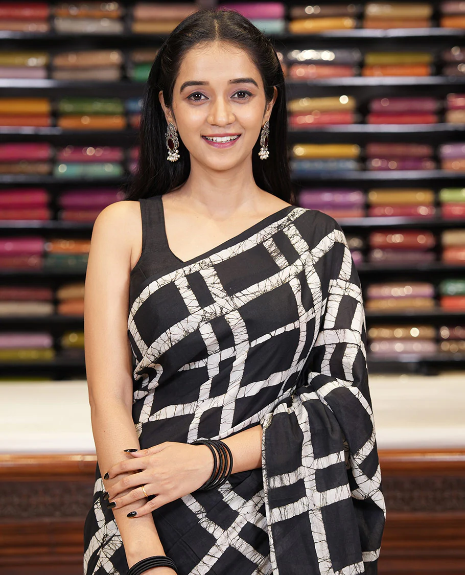 Black checked batik printed mul cotton saree, contrast kaleidoscope colored batik printed pallu, and a contrast batik printed blouse - Image 2