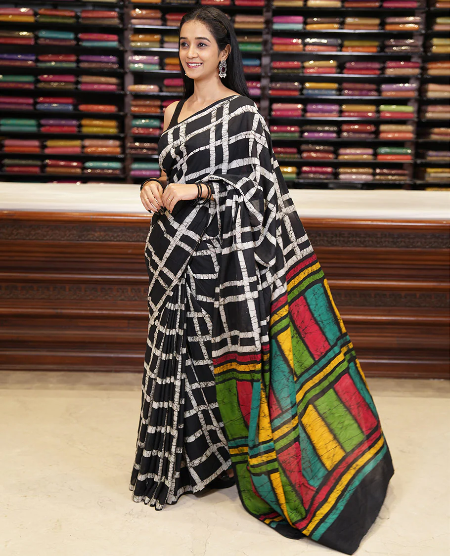 Black checked batik printed mul cotton saree, contrast kaleidoscope colored batik printed pallu, and a contrast batik printed blouse - Image 3