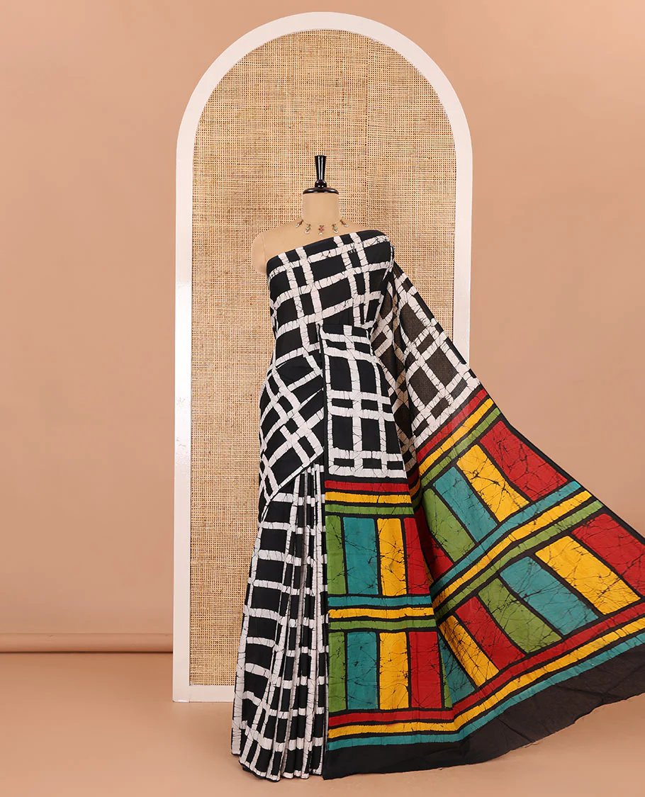 Black checked batik printed mul cotton saree, contrast kaleidoscope colored batik printed pallu, and a contrast batik printed blouse - Image 4