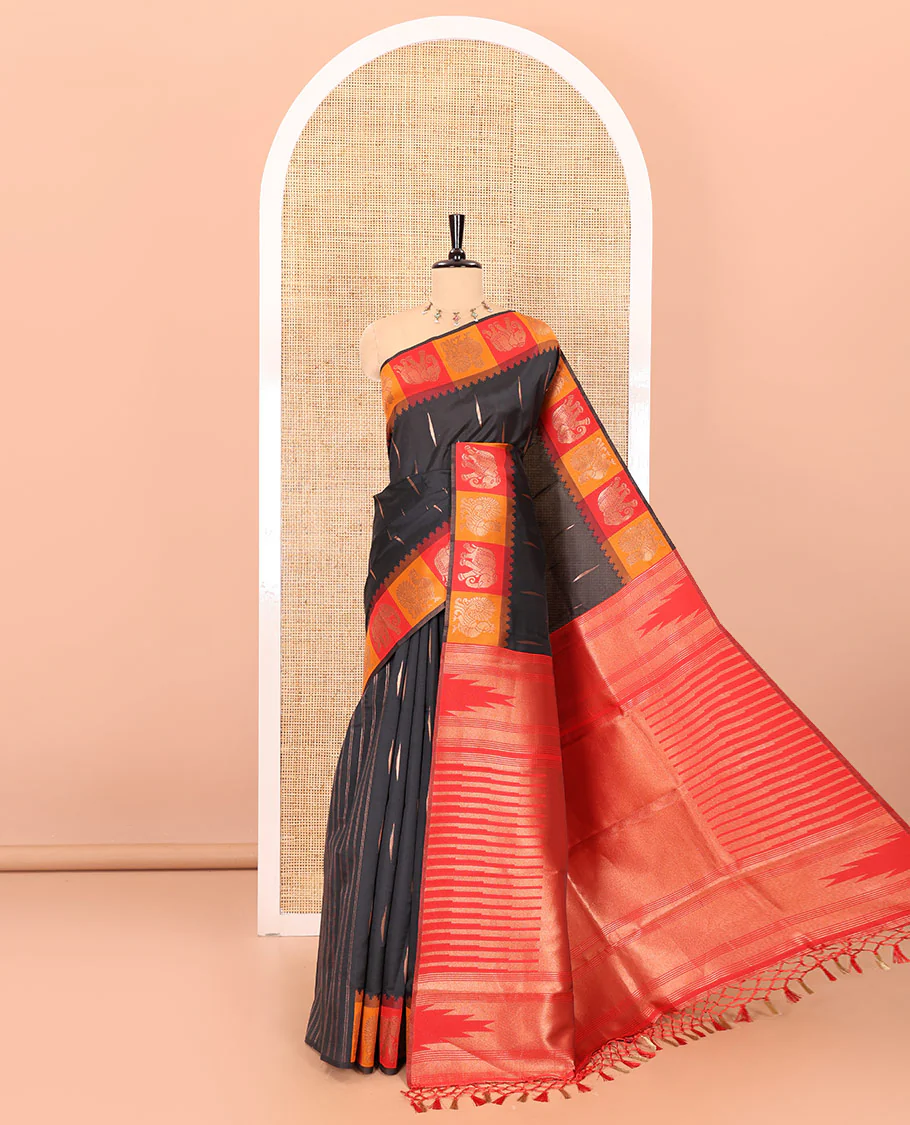Black copper zari buttas woven kanchi silk saree, contrast temple border of peacock and elephant motifs, zari-rich pallu, and a zari design blouse