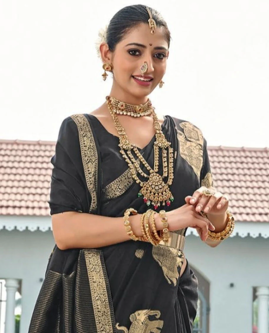 Black Designer Saree, Gracefully Embellished with Zari Buttas, Featuring a Self-Border Depicting a Herd of Elephants, Subtly Woven Pallu of Spare Stripes, and Paired with a Matching Blouse of Elephant Motifs - Image 2