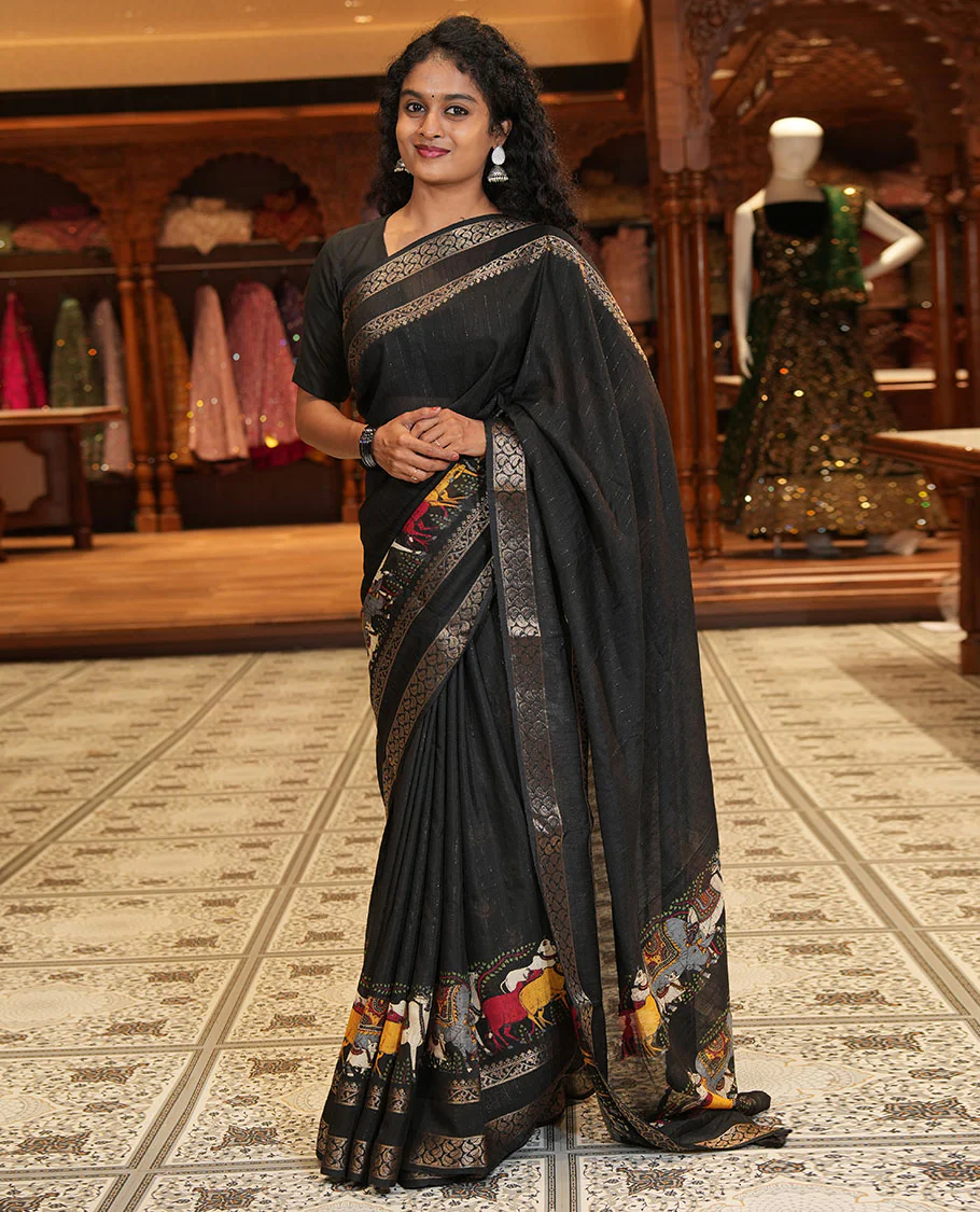 Black Dola Silk Saree Features Vertical Stripes and Pichwai Cow Motifs, Adorned with a Pallu Steeped in Pichwai Cow Motifs, and Paired with a Matching Blouse of Pichwai Lotus Motifs - Image 2