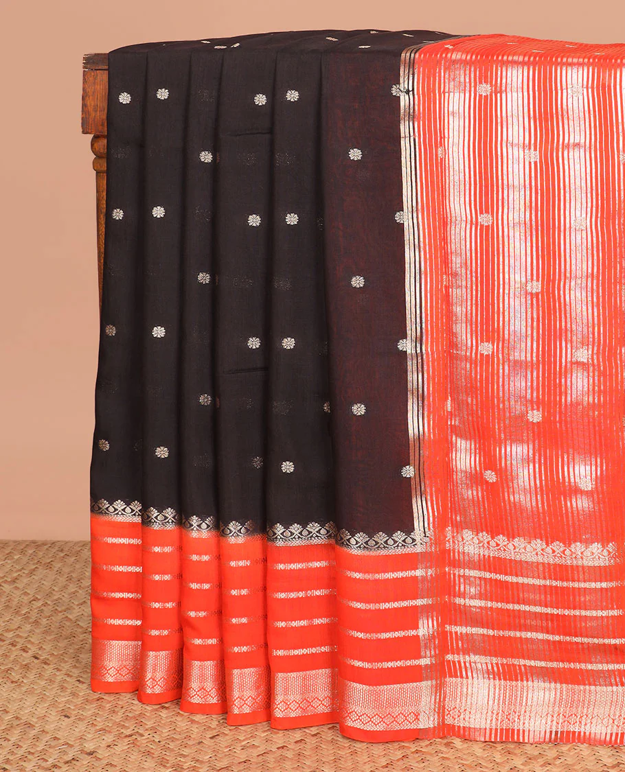 Black floral buttas assam silk saree, contrast traditional zari border, and pallu of stripes and zari buttas