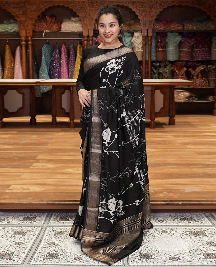 Black floral discharge printed assam silk saree, chevron striped border, zari striped pallu, and a matching blouse
