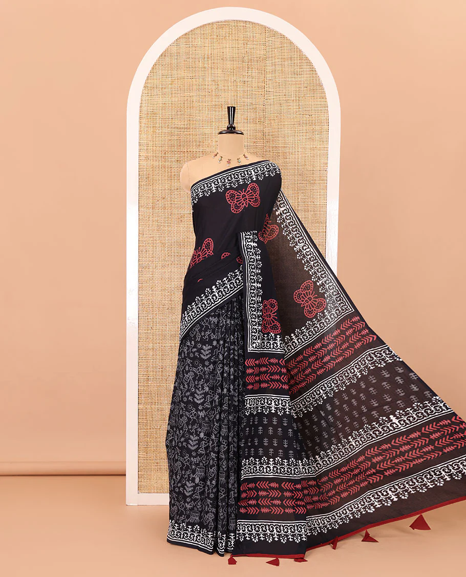 Black half-and-half style butterflies and warli theme block printed soft mul cotton saree, printed border, floral printed pallu, and a plain blouse