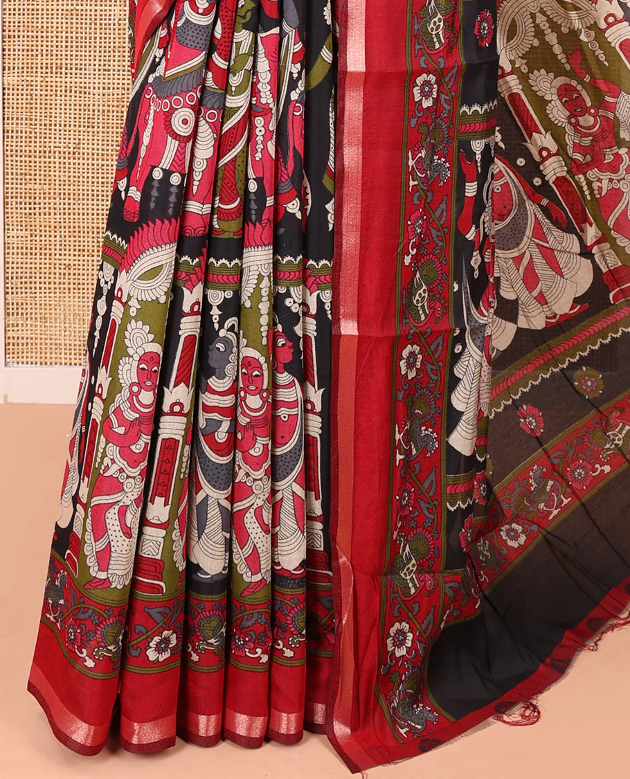 Black human figurines printed muslin cotton saree, contrast floral-peacock printed border of piping work, kalamkari printed pallu, and a contrast blouse of flower motifs print - Image 3