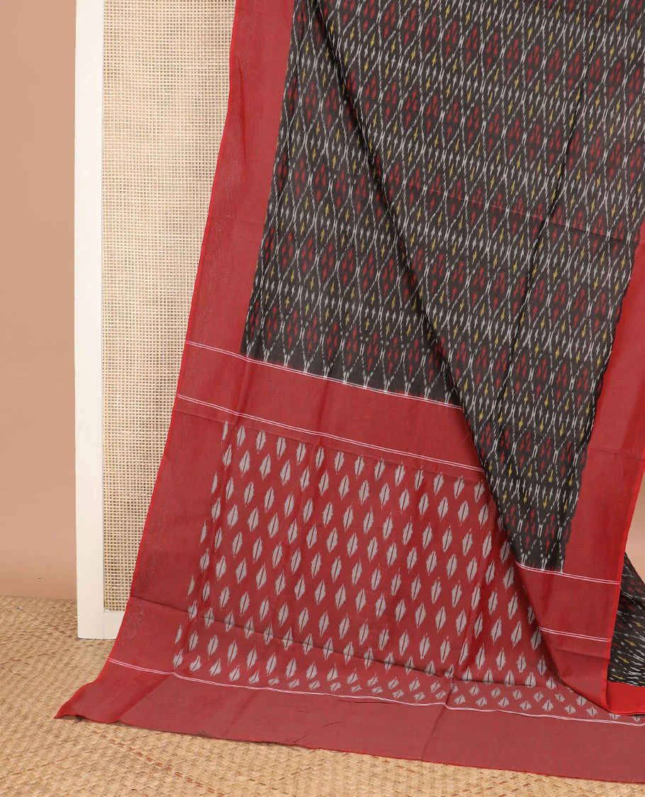 Black Ikkat Cotton Saree Adorned with Ogee Patterns in Ikkat Weave, Complemented by a Contrast Plain Border, and Pallu Steeped with Ikkat Buttas - Image 2