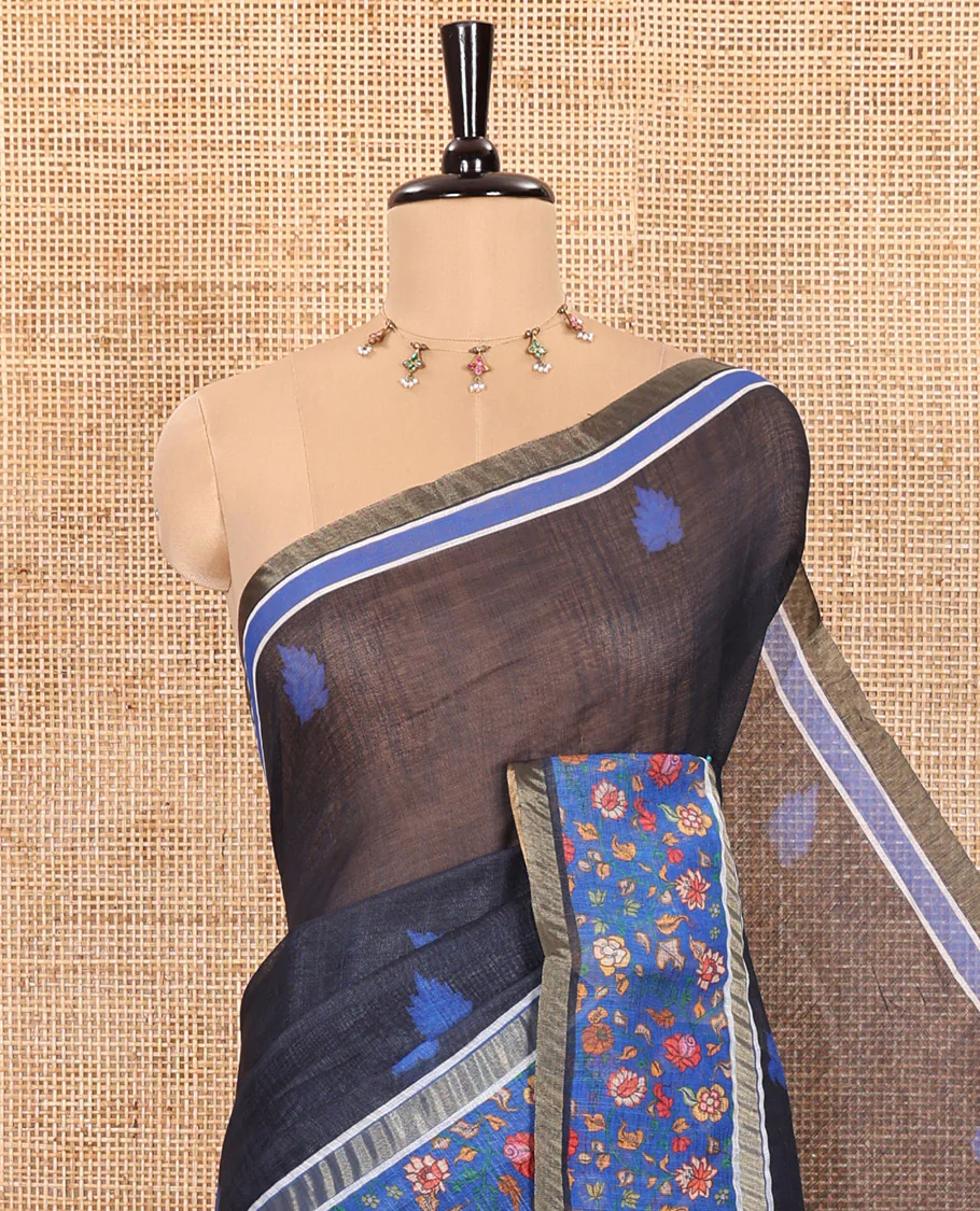 Black Linen Saree Adorned with Leaf Motifs All Over Its Body, Complemented by a Contrast Floral Vine Printed Border, Pallu Mirrors the Floral Vine Print, and Paired with a  Contrast Floral Printed Blouse - Image 2