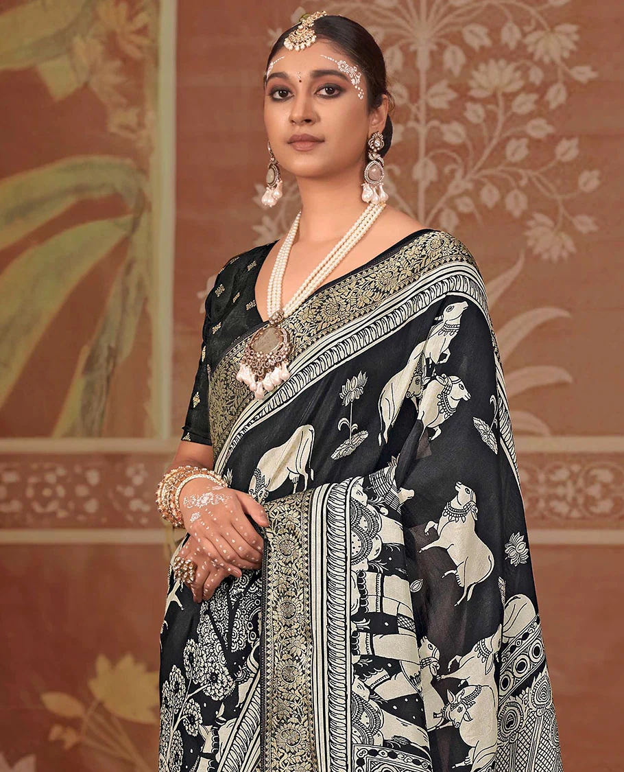 Black lotus and Pichwai cow printed designer saree, floral creeper zari border, and zari striped pallu - Image 2