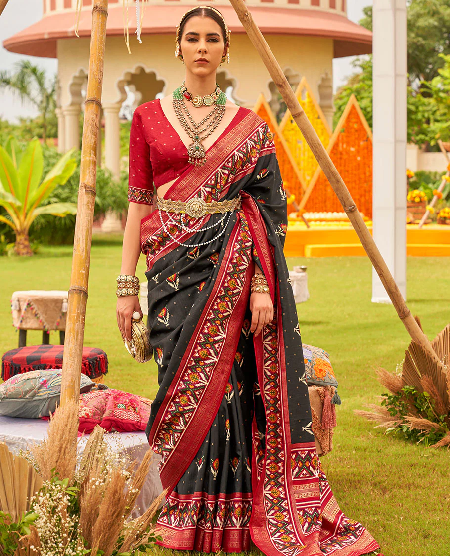 Black patola floral motifs printed designer saree, contrast intricate patola border, and floral motifs patola printed pallu