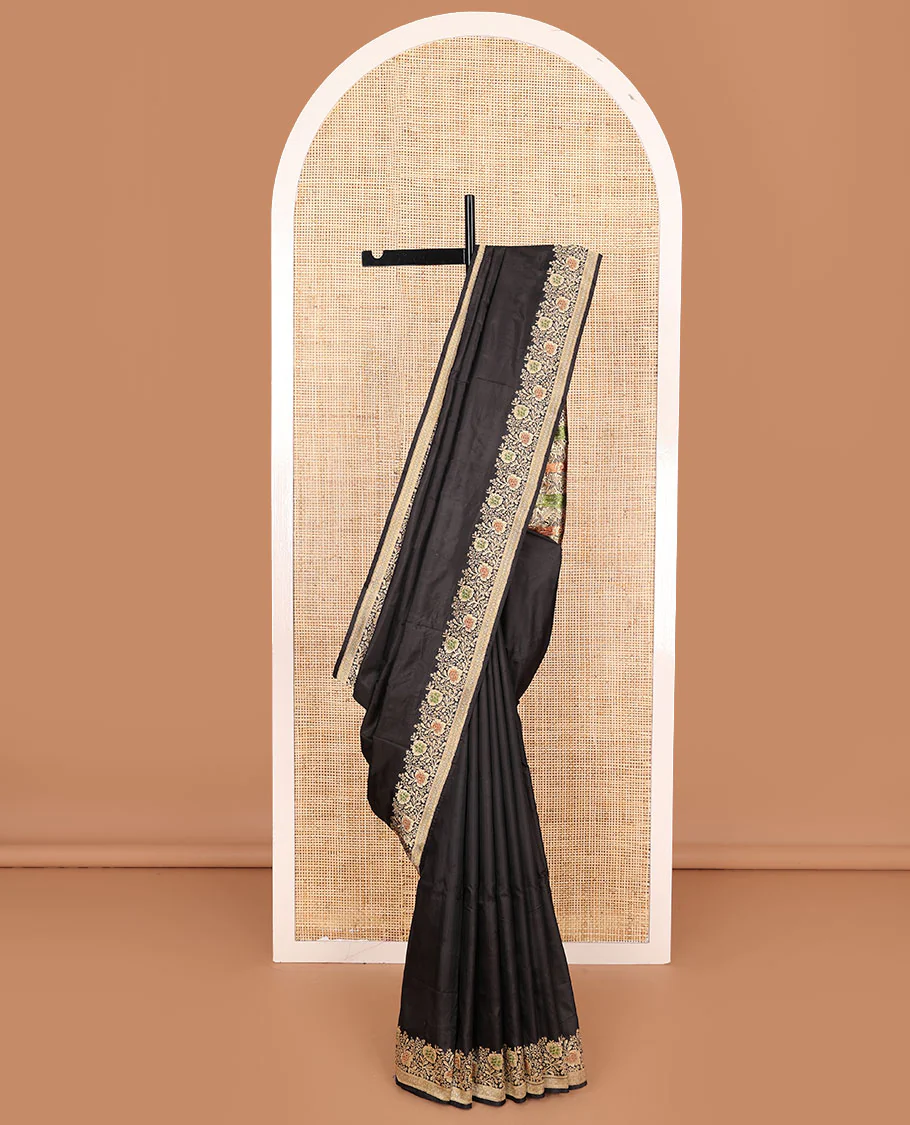 Black plain banarasi kathan silk saree, floral creeper meenakari border, and Mughal-style arches and floral design weave