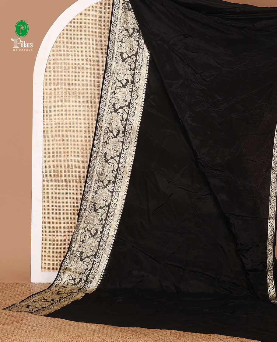 Black plain crepe saree, zari border steeped with rose floral designs, plain pallu & blouse of zari polka dots - Image 2