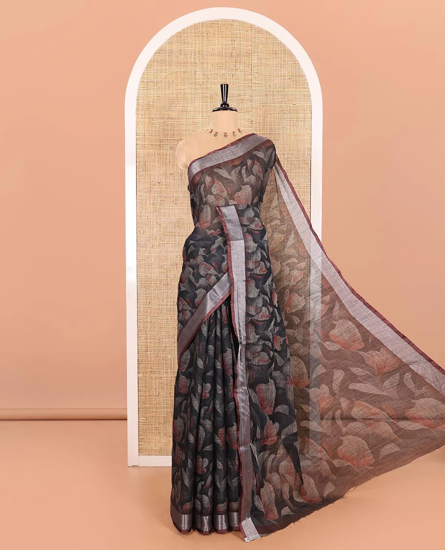 Black Printed Linen Cotton Saree Embellished with Floral Motifs, Complemented by a Contrast Bavanji Border, Featuring Floral Printed Pallu, Paired with a Subtle Matching Blouse