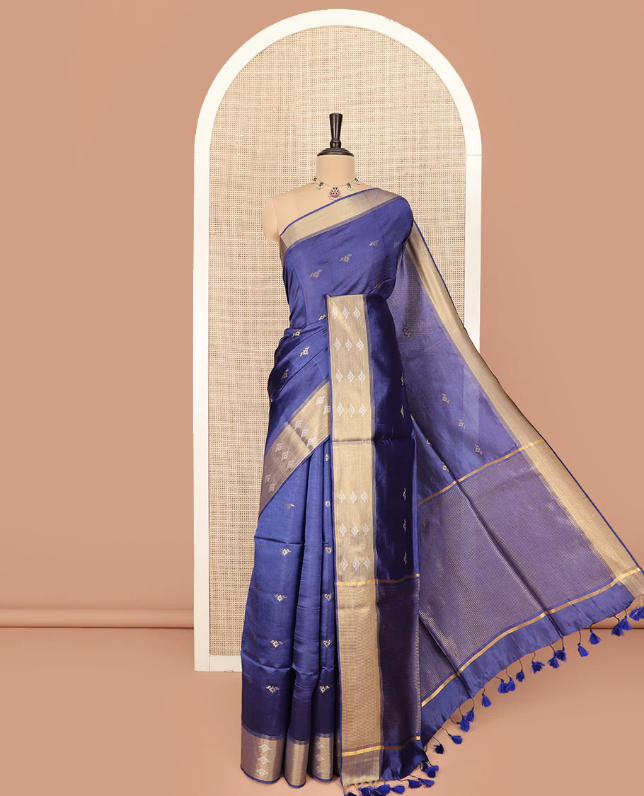 Blue Banana Pith Saree Elegantly Framed with Zari Buttas, Meticulously Crafted Border with Zari Designs, Gleaming Zari Stripes Woven Pallu, and Paired with a Matching Plain Blouse