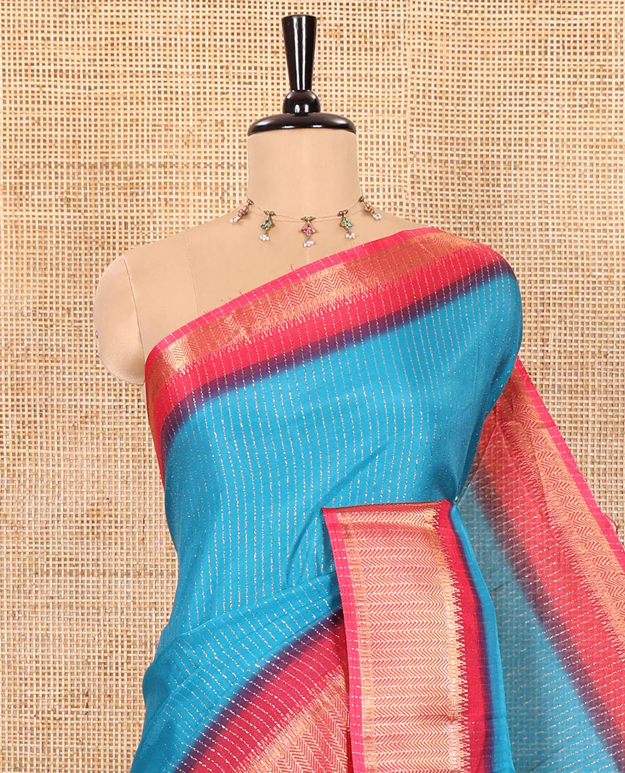 Blue Dola Silk Saree Gleamed up with Vertical Golden Stripes Running All Over Its Body, Complemented by a Contrast Traditional Zari Design Woven Border, Subtly Striped Pallu, and a Contrast Buttas Woven Blouse - Image 2