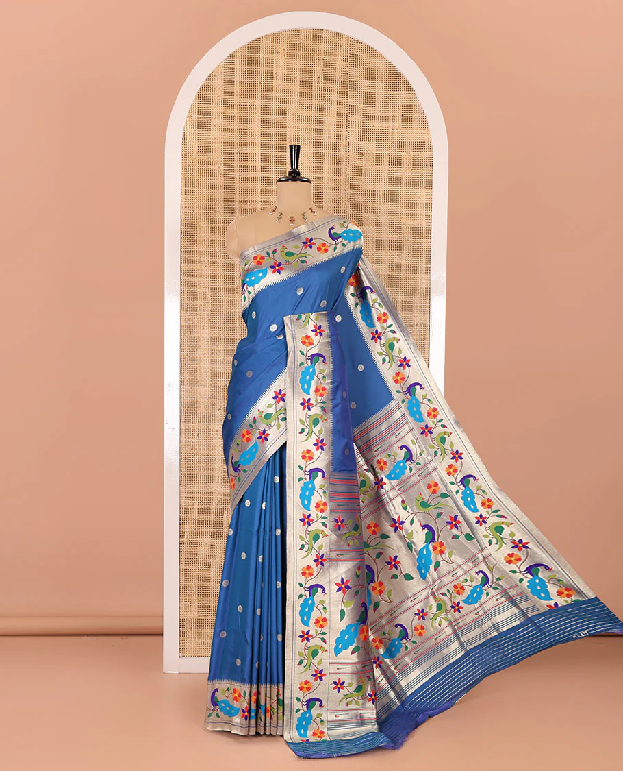 Blue floral buttas art silk paithani saree, contrast floral creeper and peacock design border, pallu of peacock and floral vine, and a matching blouse