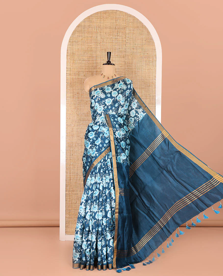 Blue floral motifs digital printed banana pith saree, zari piping border, striped pallu, and a matching floral printed blouse