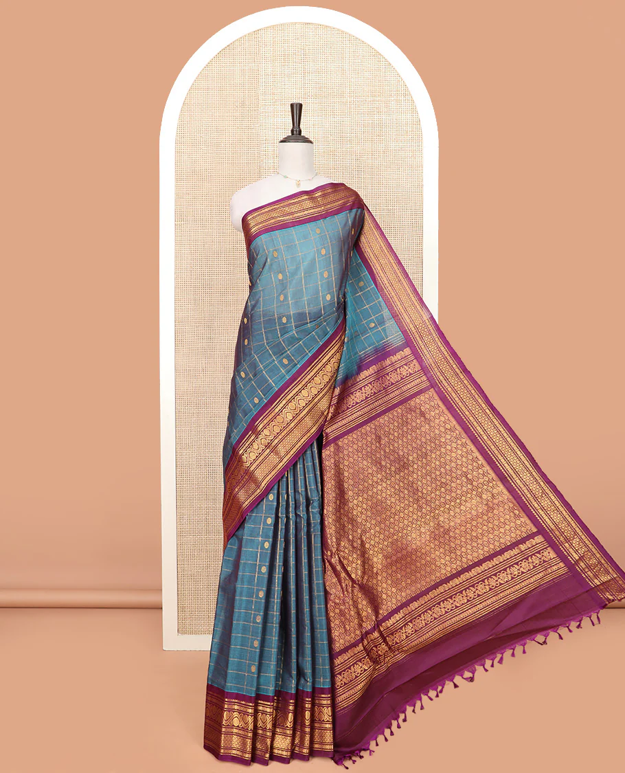 Blue Gadwal Saree Features Zari Butta Enclosed Checks, Contrasting Border Steeped with Traditional Zari Designs, Pallu of Intricate Design, and a Contrast Blouse Ornamented with Zari Designs