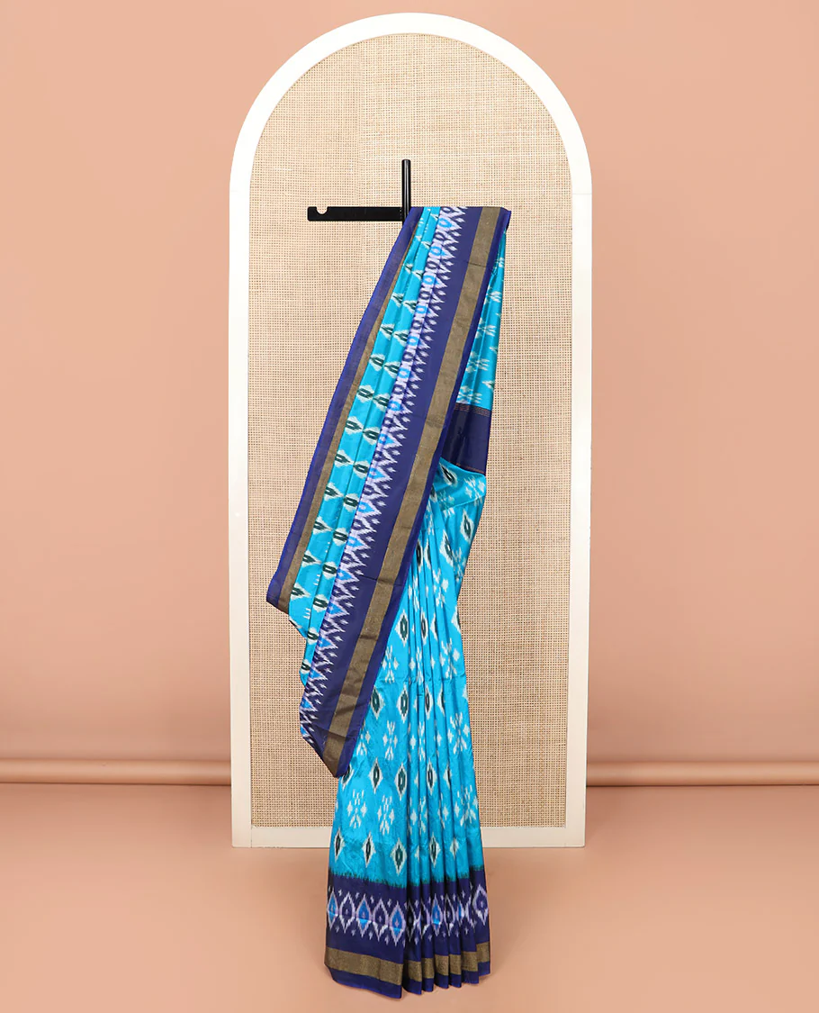 Blue Ikkat Silk Saree Decorated with Ikkat Buttas, Complemented by a Contrast Border, a Subtly Woven Pallu of Jaal Design, and a Contrast Plain Blouse - Image 2