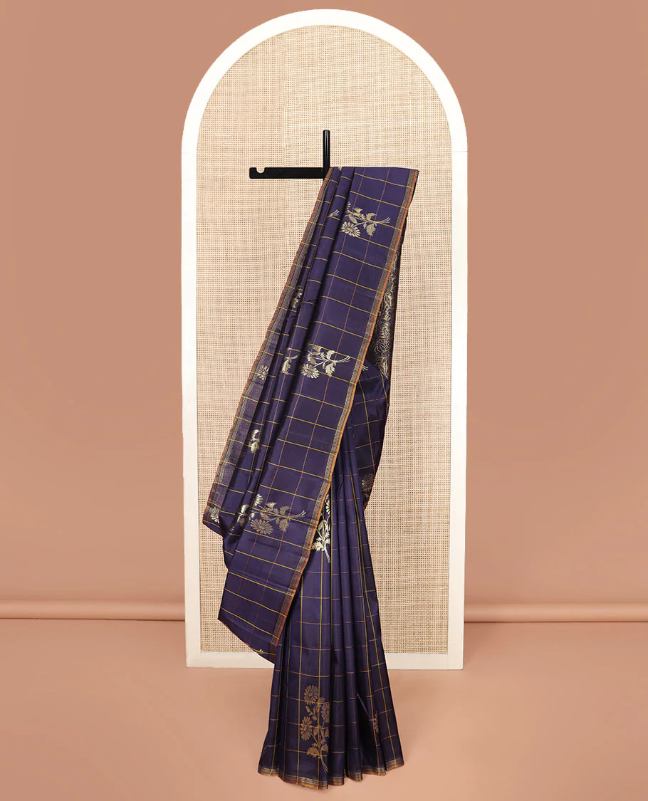Blue Kanchipuram Silk Saree Highlighted with Floral Buttas Enclosed in Checks, Adorned with a Contrast Piping Border, Pallu Depicting Rose Florals in Zari, Saree Paired with a Matching Blouse