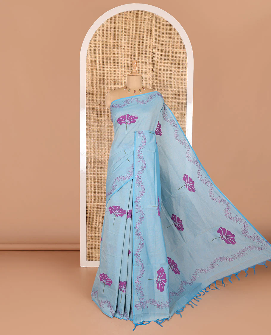 Blue lotus leaf motifs printed South cotton saree with floral creeper border, a matching blouse, and a contrast buttas block printed blouse