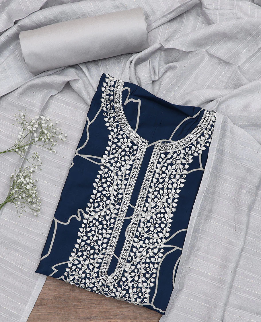 Blue material churidar set, floral printed and embroidered top, contrast plain bottom, and a sequins embroidered dupatta