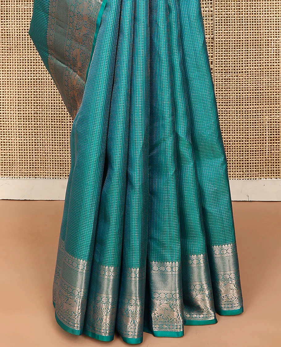 Blue micro-checked Vasundhara silk saree, zari border of thilakam mokku, poo chakram, kuyil kann, rudraksham, and kuthirai designs, and jaal pallu - Image 5