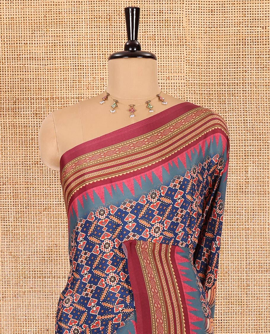 Blue patola style geometric printed Italian Crepe saree, contrast temple ikkat printed border, Kalamkari printed pallu, and a printed bordered blouse - Image 3