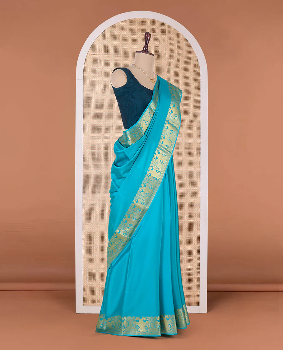Blue plain Mysore silk saree, two-headed eagle motifs zari border, and pallu