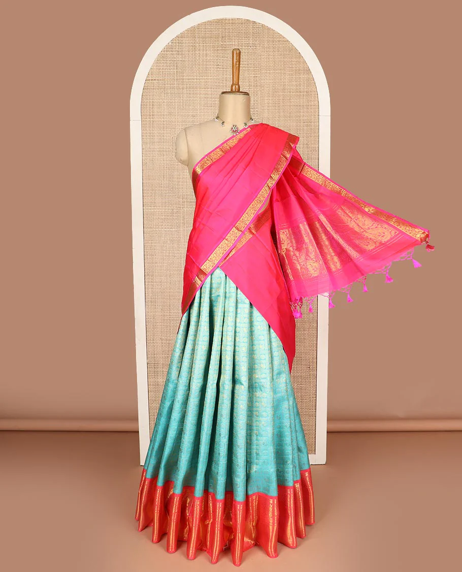 Blue pure silk half saree, mayil chakram enclosed checked skirt, contrast border and blouse of kodi visiry, neli, muthu, lavangam, and jaal, and intricate dhavani