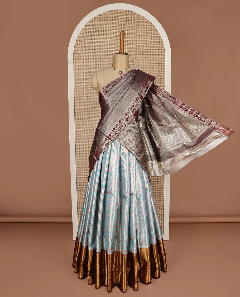 Blue puresilk halfsaree, floral jaal jacquard skirt, contrast blouse, and border of salngai,neli,poun,jaal,manga and jaal, and dhavani of embossed with zari weave