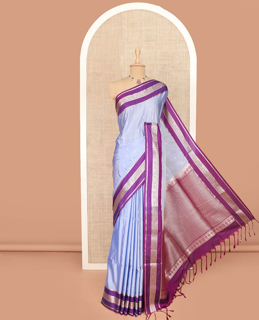 Blue Semi-Soft Silk Saree Opulently Embellished with Zari Buttas Woven Across Its Body, Complemented by a Contrast Varisai Pettu Traditional Zari Border, Richly Detailed Pallu of Jaal Designs, and Paired with a Contrast Blouse