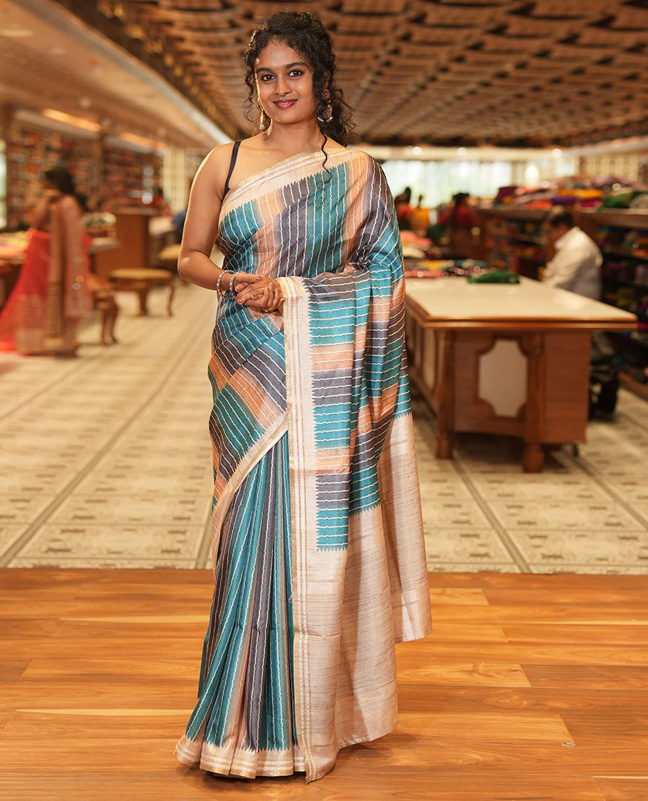 Blue Semi-Tussar Saree Colorfully Printed with Zig-Zag Stripes, Subtly Woven with a Resham Thread Temple Border, Featuring a Heathered Pallu, Paired with a Contrast Striped Blouse