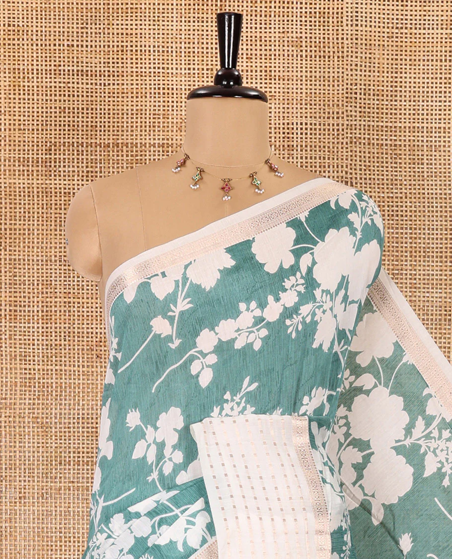 Blue silhouette-style floral discharge printed Assam silk saree, contrast traditional zari border of rudraksham motifs, zari striped pallu, and a floral printed blouse - Image 2