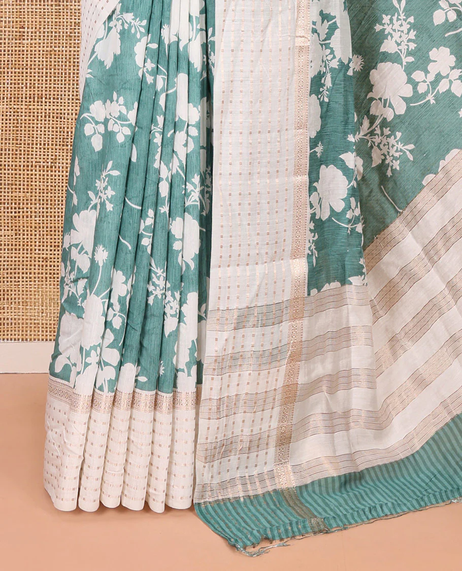 Blue silhouette-style floral discharge printed Assam silk saree, contrast traditional zari border of rudraksham motifs, zari striped pallu, and a floral printed blouse - Image 3