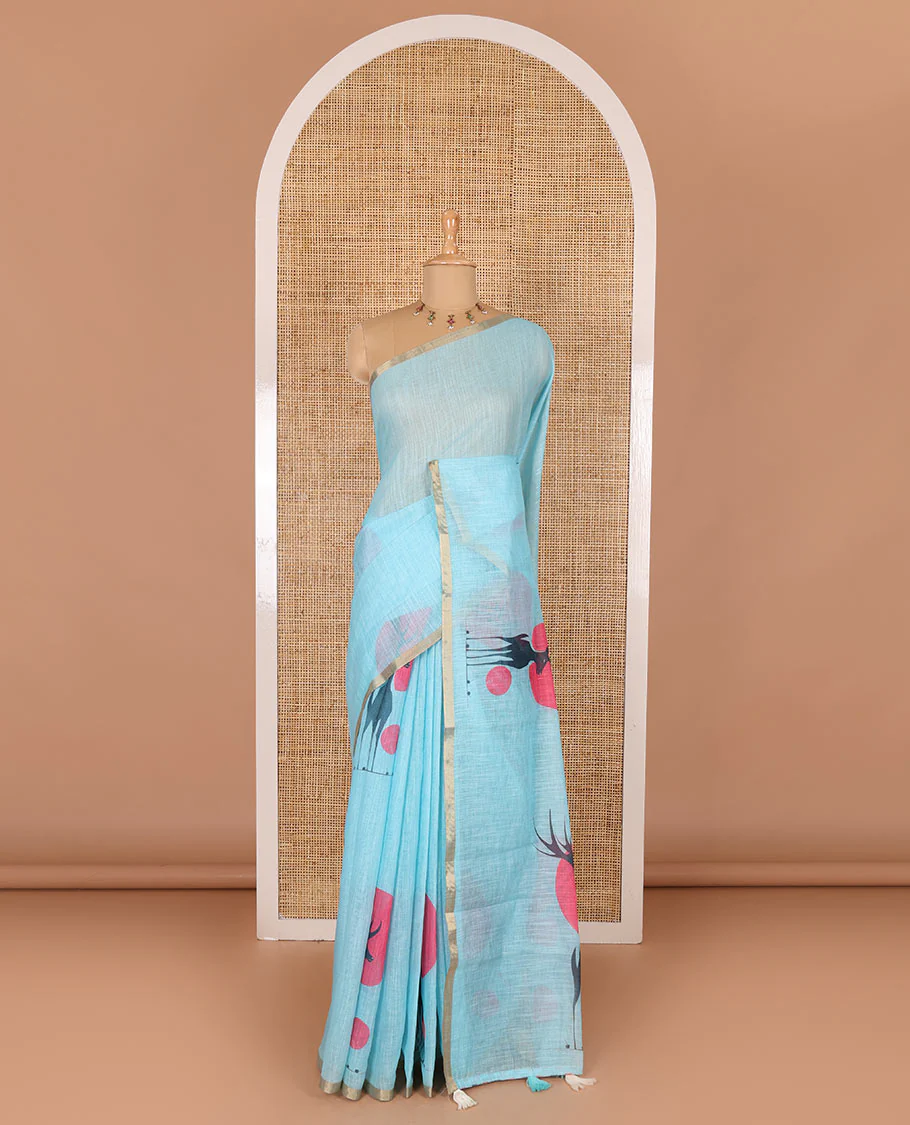 Blue sun and deer silhouette printed linen cotton saree, gold zari piping border, printed pallu, and a matching stripes printed blouse - Image 2