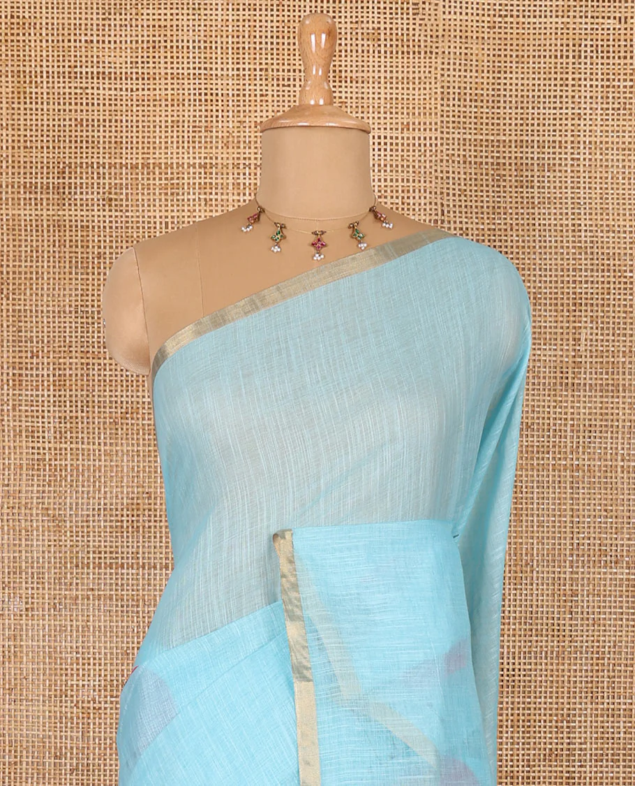 Blue sun and deer silhouette printed linen cotton saree, gold zari piping border, printed pallu, and a matching stripes printed blouse - Image 3