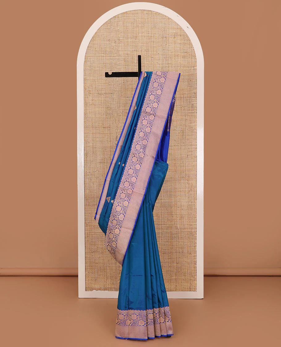 Blue thilakam motifs katan silk saree, traditional border of floral creeper design, and jaal pallu
