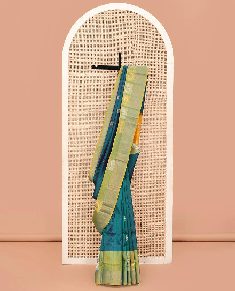 Blue Uppada Silk Saree Elevated with Floral Zari Buttas, Complemented by a Contrast Border of Floral Butta Enclosed Square Design, Pallu Decked Up with Intricate Designs, and Paired with a Contrast Blouse