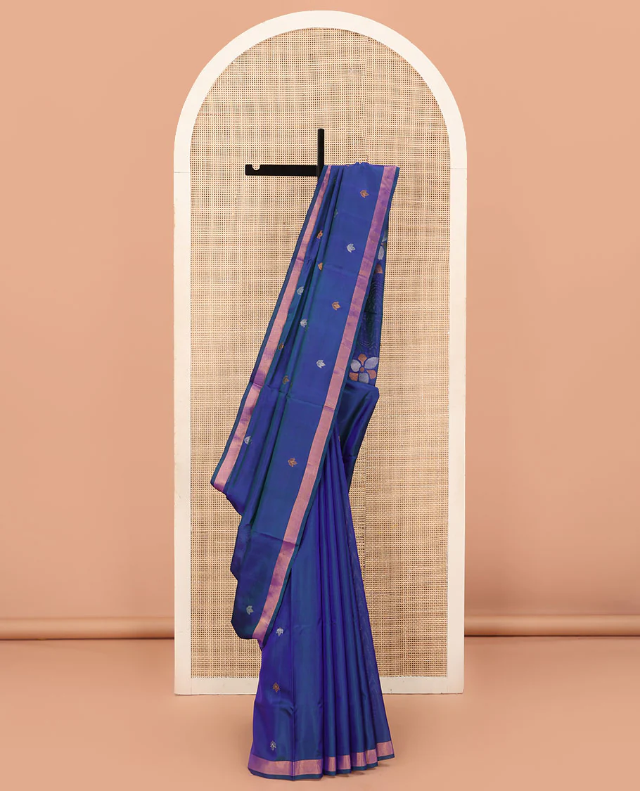 Blue Uppada Silk Saree Featuring Floral Buttas, Subtle Zari Bavanji Border, Pallu Decked Up with Jamdani-Style Floral Motifs, and Paired with a Matching Blouse