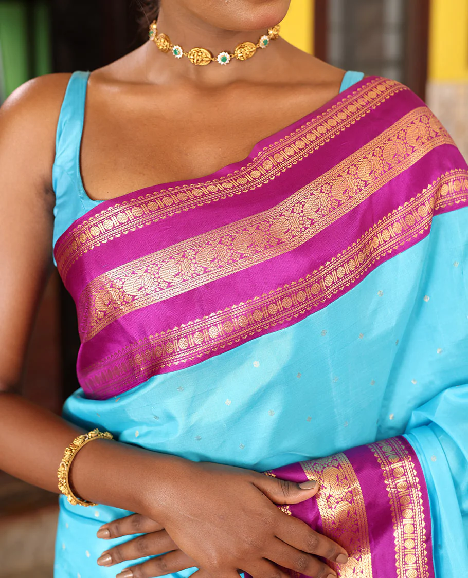 Blue Vasundhara Silk Saree Gracefully Embellished with Zari Buttas, Complemented by a Varisai Pettu Border Featuring Rekku, Muthu, Banaras, Rudraksham, and Mayil Designs, Majestically Woven with a Zari-Designed Pallu, and Paired with a Contrast Blouse - Image 3