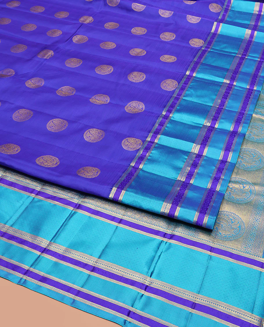 Blue Vasundhara Silk Saree Majestically Detailed with Round Mayil Buttas, Complemented with a Contrast Border of Traditional Zari Designs, Richly Detailed Pallu of Jaal Designs, and Paired with a Contrast Blouse - Image 2